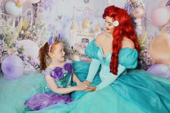 The Mermaid Princess posing with a little princess