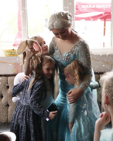 The Ice Queen with a group of Little Princesses