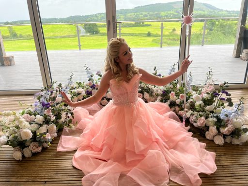 The Good Witch The Good Witch in her pink dress, curly blonde hair and royal staff
