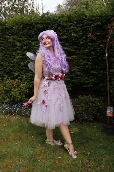Lilac Flower Fairy. Our fairy has lilac hair, a lilac dress with flower appliqué, and matching pumps